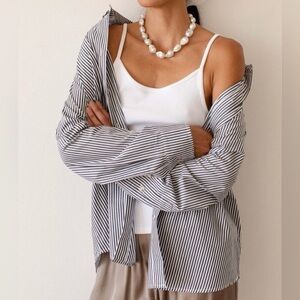 DONNI. The Pop Button Down